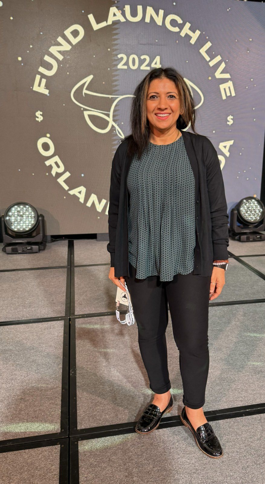 Rashmi on stage at Fund Launch Live, Orlando