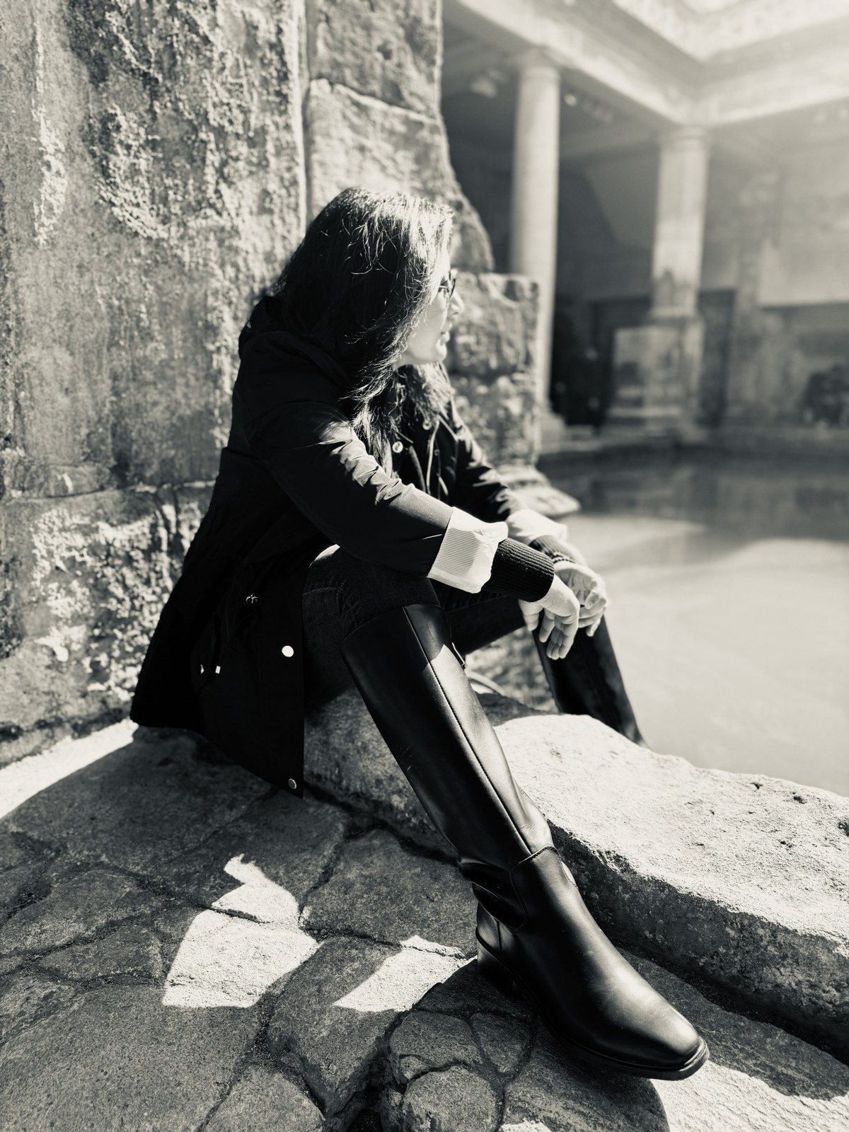 Rashmi seated beside the Roman Baths